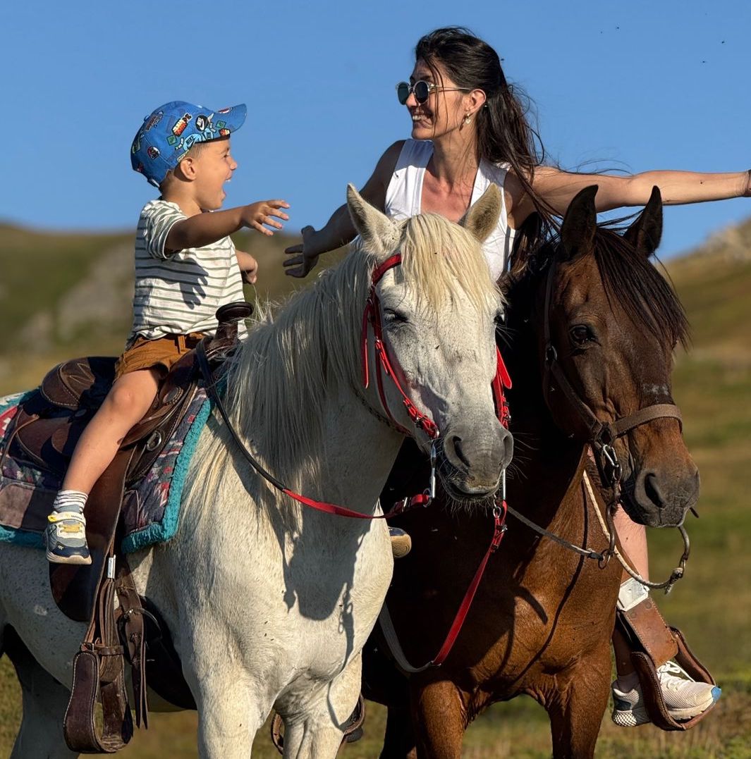Mother and son on horses